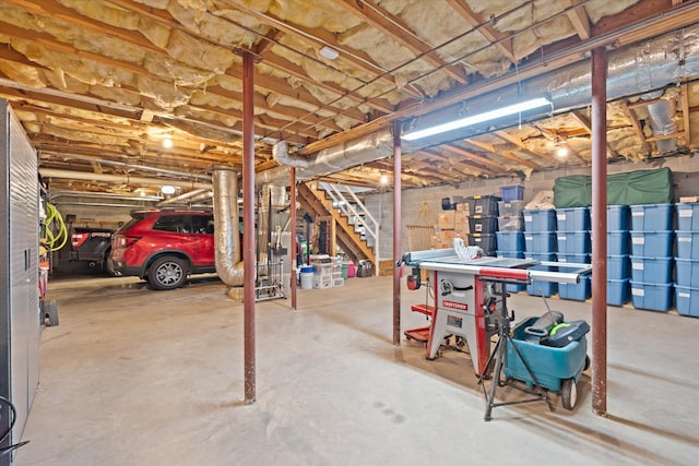 unfinished basement featuring stairs