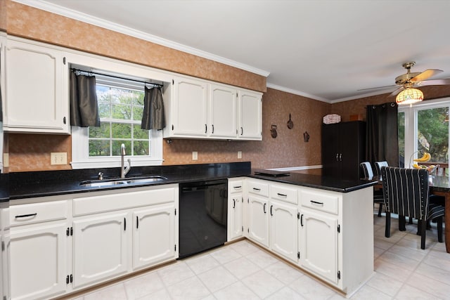 kitchen featuring a peninsula, dishwasher, a sink, and plenty of natural light