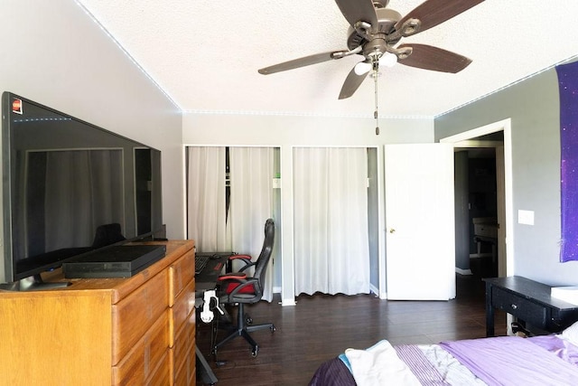 bedroom with a ceiling fan and dark wood finished floors