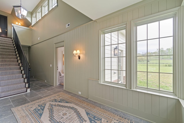 4535 Peytonsville Rd, Franklin, TN 37064 - entryway featuring visible vents, a wealth of natural light, stone tile floors, and stairs