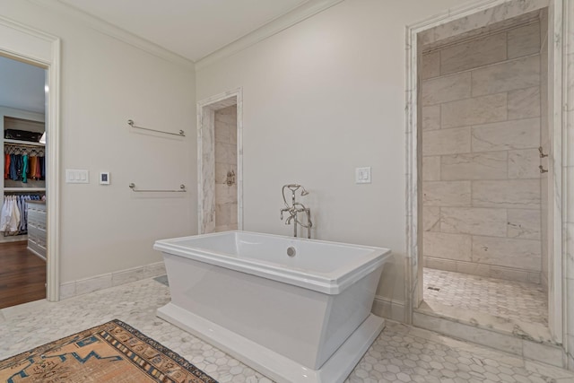 4535 Peytonsville Rd, Franklin, TN 37064 - full bathroom featuring baseboards, a freestanding bath, a spacious closet, crown molding, and tiled shower