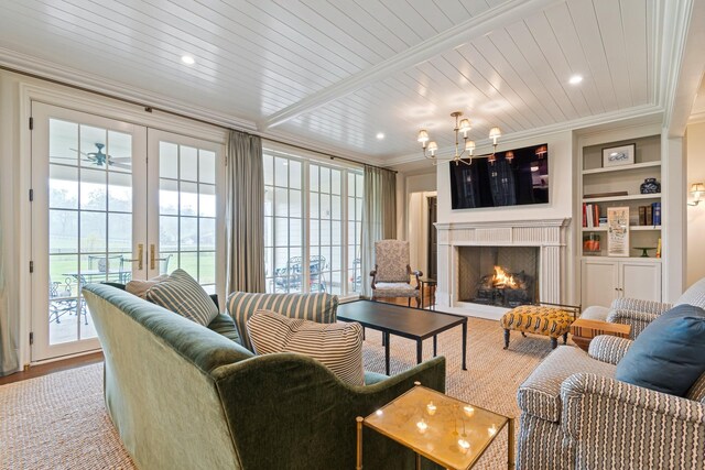 4535 Peytonsville Rd, Franklin, TN 37064 - living room with ornamental molding, a warm lit fireplace, recessed lighting, built in shelves, and wood finished floors