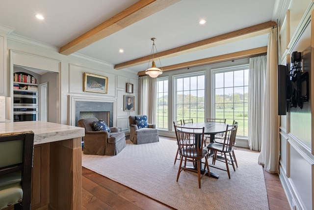 4535 Peytonsville Rd, Franklin, TN 37064 - dining room with beamed ceiling, a fireplace, ornamental molding, recessed lighting, and wood finished floors
