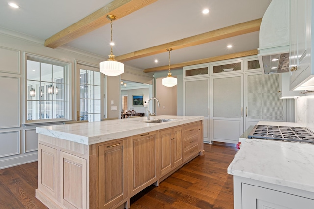 4535 Peytonsville Rd, Franklin, TN 37064 - kitchen with a sink, dark wood-style flooring, a kitchen island with sink, beam ceiling, and light stone countertops