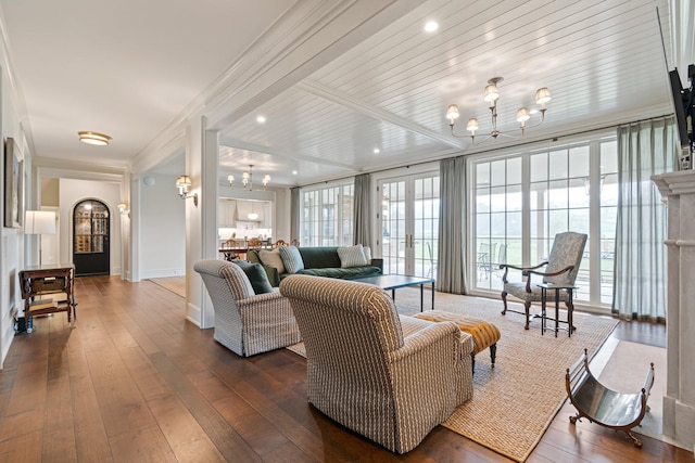 4535 Peytonsville Rd, Franklin, TN 37064 - living room featuring an inviting chandelier, ornamental molding, plenty of natural light, and dark wood-style flooring