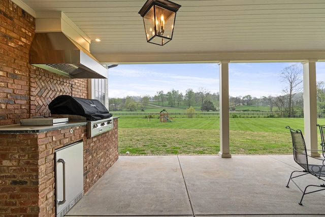 4535 Peytonsville Rd, Franklin, TN 37064 - view of patio / terrace with exterior kitchen, fence, a grill, a rural view, and a playground