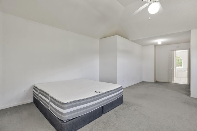 bedroom with baseboards, vaulted ceiling, a ceiling fan, and carpet floors
