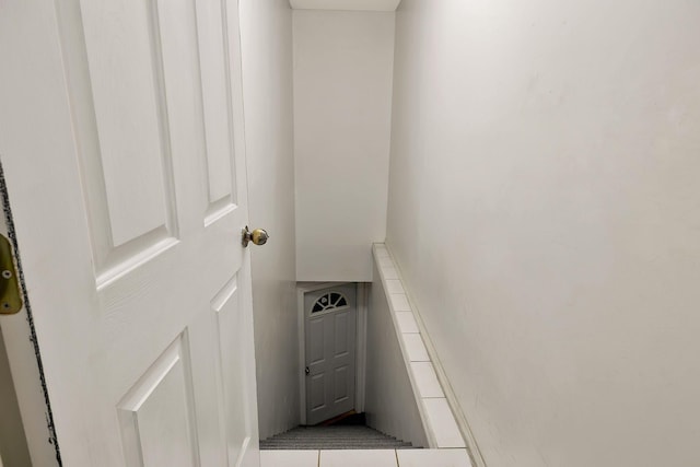 staircase with tile patterned flooring