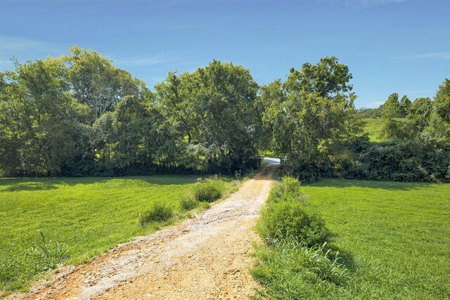 view of street featuring a forest view