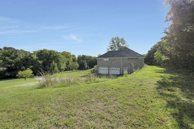 view of yard featuring a garage