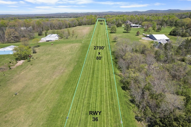 birds eye view of property with a rural view