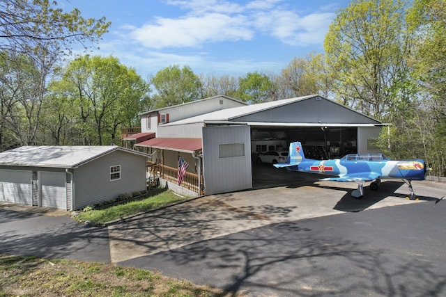 exterior space featuring an outbuilding and a detached garage