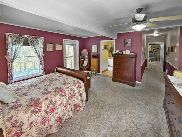 bedroom with ensuite bathroom, baseboards, a ceiling fan, a textured ceiling, and carpet flooring