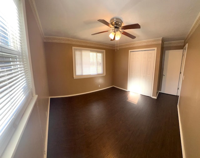 7459 Horn Tavern Rd, Fairview, TN 37062 - unfurnished bedroom featuring a closet, baseboards, ornamental molding, dark wood-type flooring, and ceiling fan
