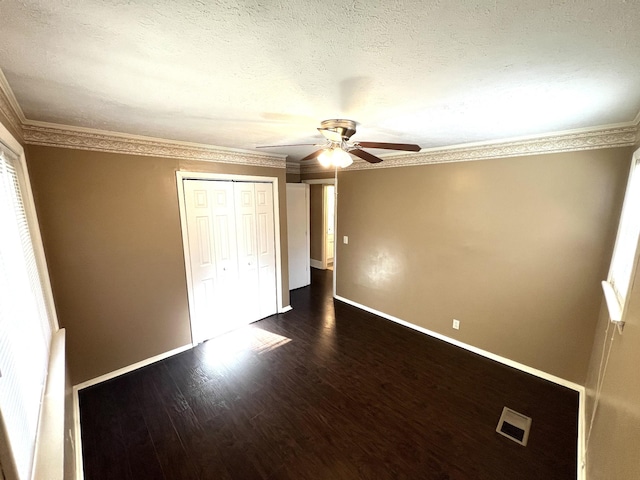 7459 Horn Tavern Rd, Fairview, TN 37062 - unfurnished bedroom with a closet, baseboards, dark wood finished floors, and visible vents