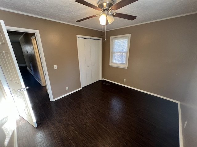 7459 Horn Tavern Rd, Fairview, TN 37062 - unfurnished bedroom with ceiling fan, a textured ceiling, a closet, dark wood-style flooring, and baseboards