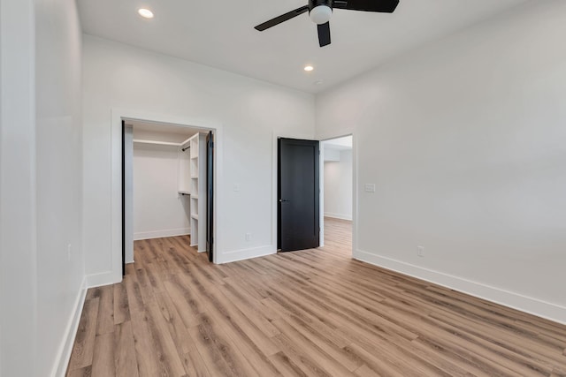 418 Mercomatic Dr, Nashville, TN 37209 - unfurnished bedroom with baseboards, a spacious closet, light wood-style flooring, recessed lighting, and ceiling fan