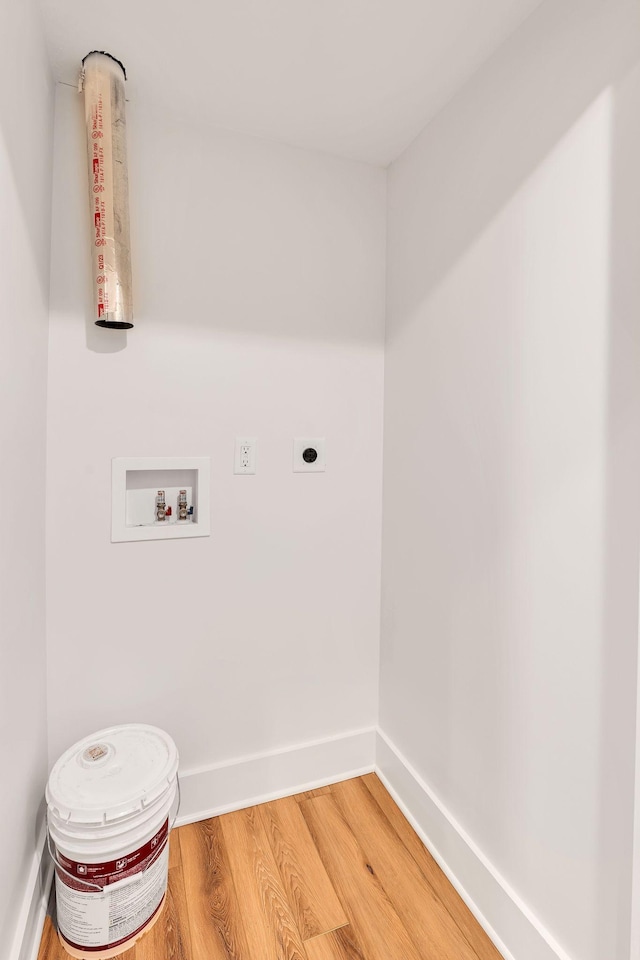 418 Mercomatic Dr, Nashville, TN 37209 - laundry room with electric dryer hookup, washer hookup, light wood-style flooring, and baseboards
