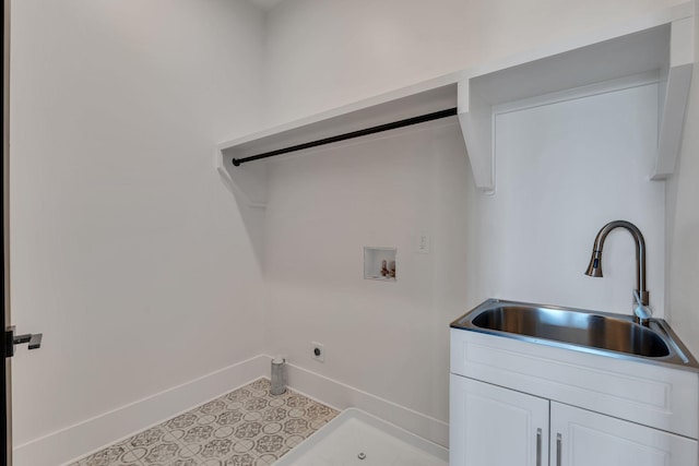 418 Mercomatic Dr, Nashville, TN 37209 - laundry area featuring a sink, hookup for an electric dryer, hookup for a washing machine, and baseboards