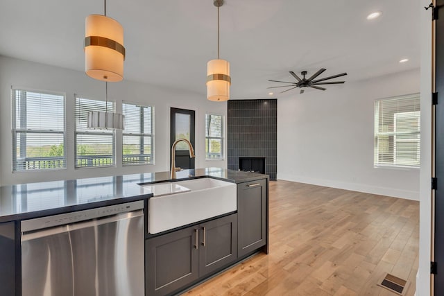 418 Mercomatic Dr, Nashville, TN 37209 - kitchen featuring stainless steel dishwasher, a sink, pendant lighting, open floor plan, and ceiling fan