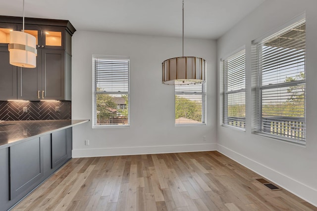 418 Mercomatic Dr, Nashville, TN 37209 - unfurnished dining area with plenty of natural light, light wood finished floors, and baseboards