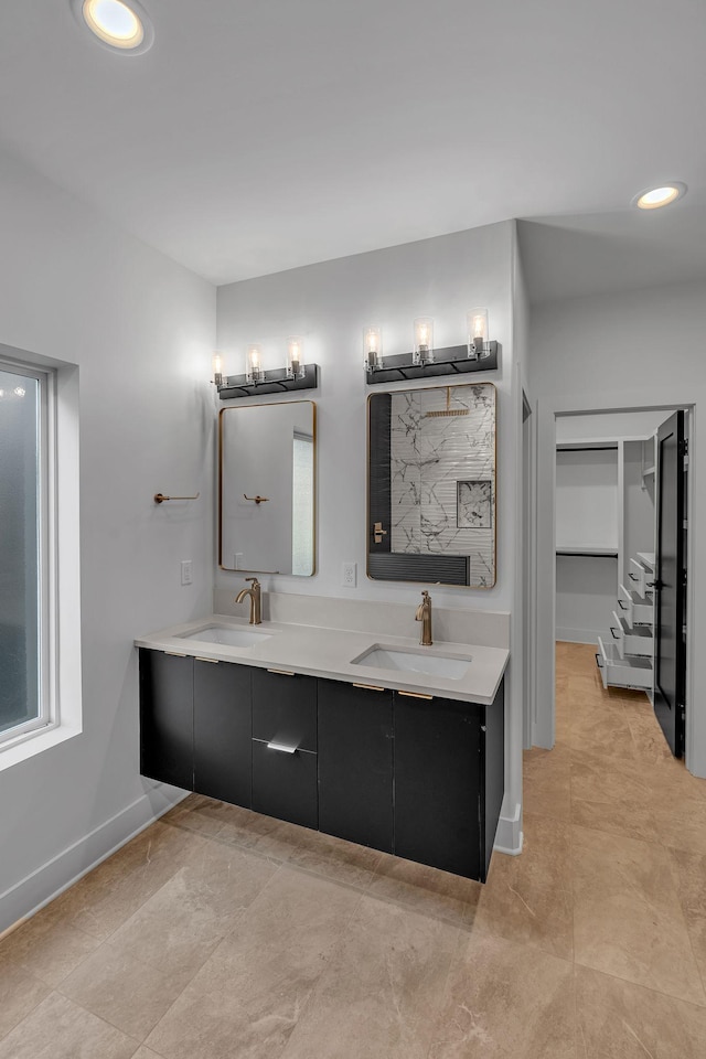 418 Mercomatic Dr, Nashville, TN 37209 - bathroom with double vanity, baseboards, recessed lighting, and a spacious closet