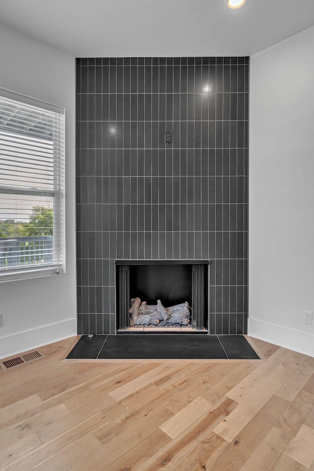 418 Mercomatic Dr, Nashville, TN 37209 - detailed view of a fireplace, wood finished floors, and baseboards