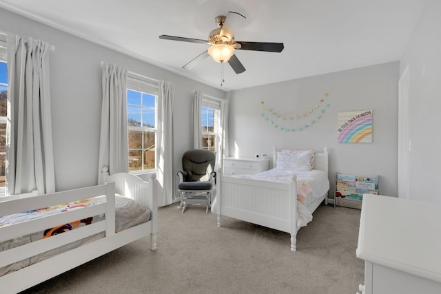 bedroom featuring ceiling fan and light colored carpet