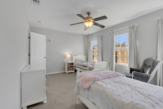bedroom with light carpet, baseboards, visible vents, and ceiling fan