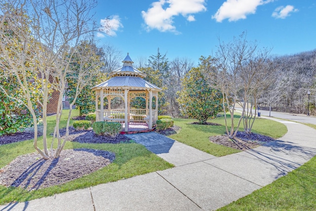 surrounding community featuring a lawn and a gazebo