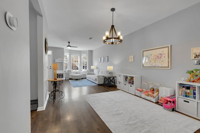 recreation room featuring ceiling fan with notable chandelier, wood finished floors, and visible vents