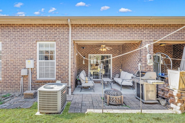 view of patio / terrace featuring an outdoor living space with a fire pit, area for grilling, and central AC unit