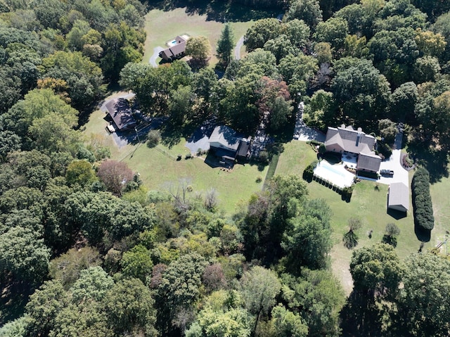 birds eye view of property with a wooded view