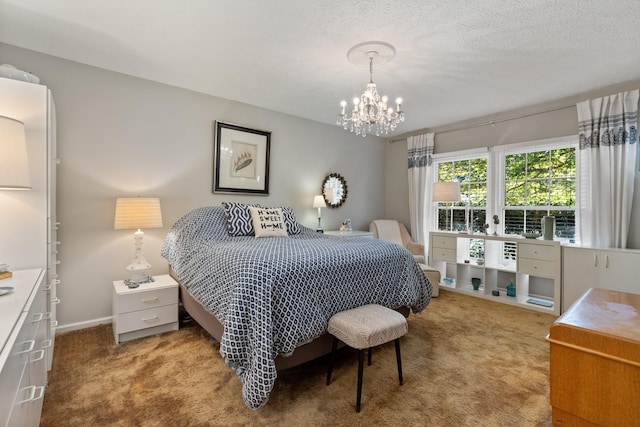 bedroom with carpet flooring, a chandelier, and a textured ceiling