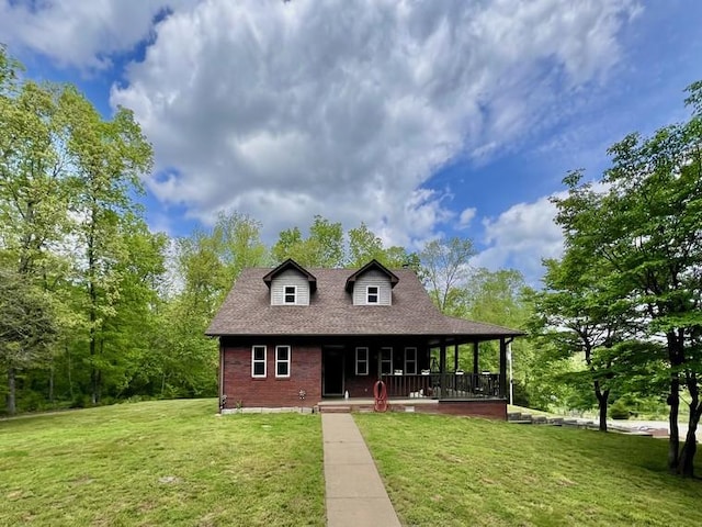5199 Nelson Rd, Westpoint, TN 38486 - view of front facade featuring a porch, brick siding, roof with shingles, and a front yard