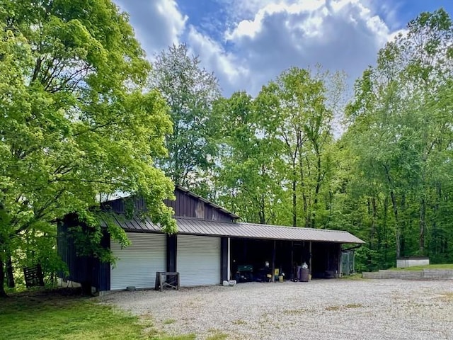 5199 Nelson Rd, Westpoint, TN 38486 - garage with gravel driveway