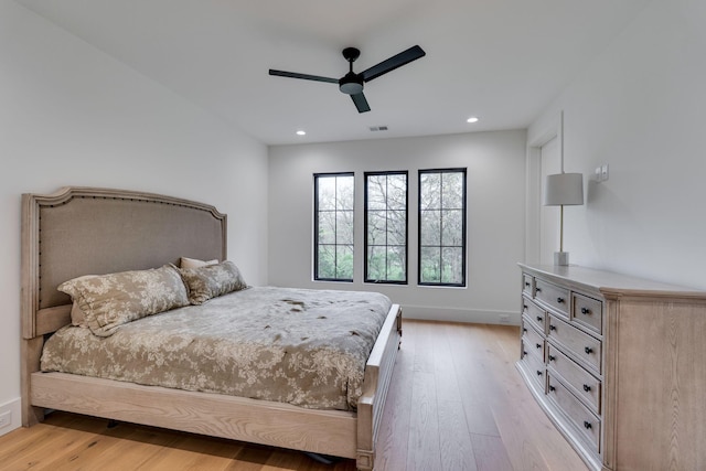 bedroom with light wood-style flooring, baseboards, visible vents, recessed lighting, and a ceiling fan