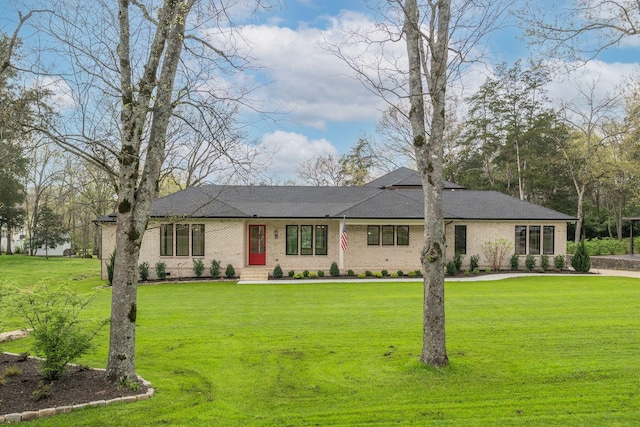 ranch-style home with a front yard