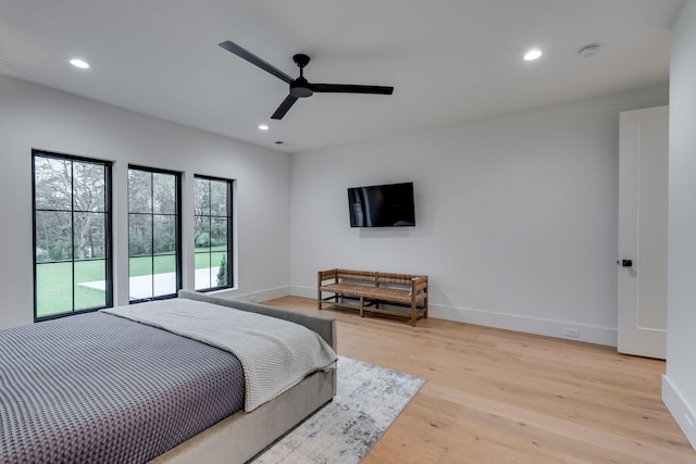 bedroom featuring recessed lighting, light wood-type flooring, baseboards, and ceiling fan