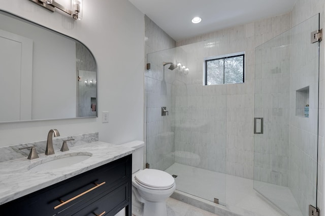 full bathroom with vanity, recessed lighting, a shower stall, and toilet