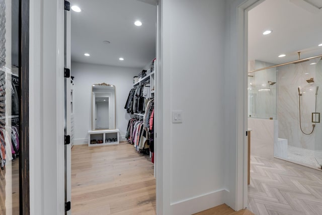 spacious closet with light wood-style floors