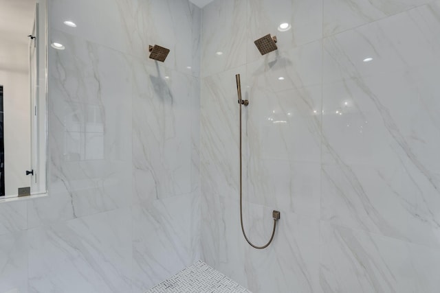 full bath featuring a marble finish shower
