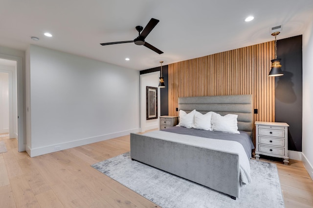 bedroom with baseboards, a ceiling fan, wood finished floors, and recessed lighting