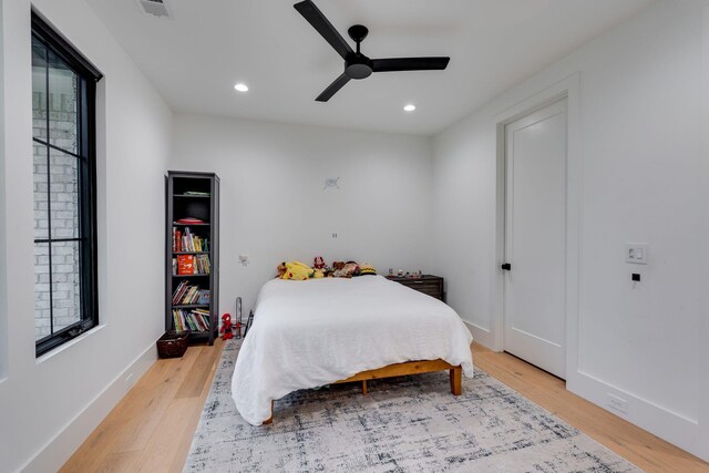 bedroom with a ceiling fan, light wood-style floors, and recessed lighting