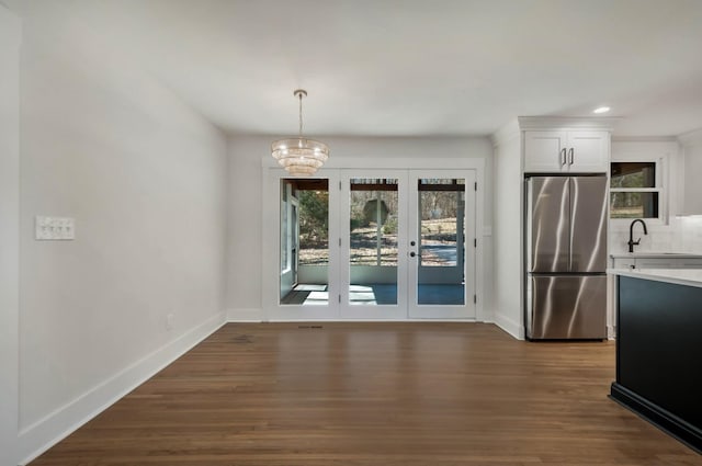931 Downey Dr, Nashville, TN 37205 - unfurnished dining area featuring a chandelier, dark wood finished floors, baseboards, and french doors