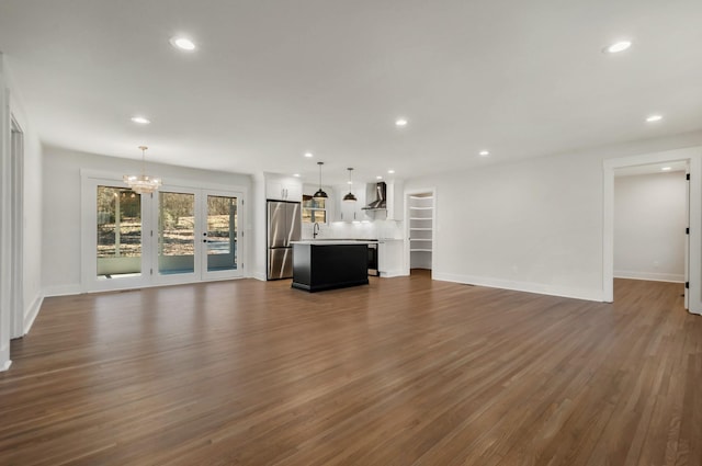 931 Downey Dr, Nashville, TN 37205 - unfurnished living room featuring recessed lighting, dark wood-style floors, a sink, baseboards, and a notable chandelier