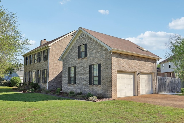 view of front facade featuring a chimney, fence, a front lawn, driveway, and brick siding