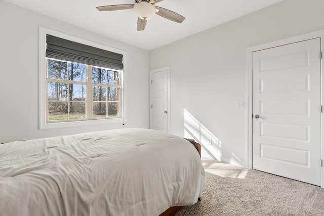 bedroom with ceiling fan and carpet flooring