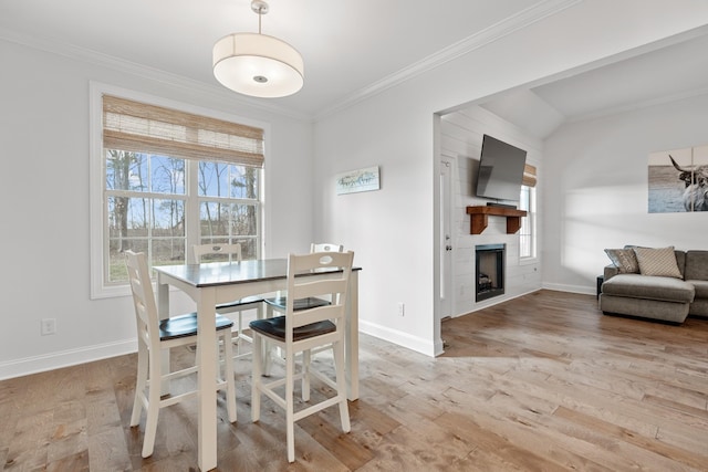 dining space with baseboards and ornamental molding