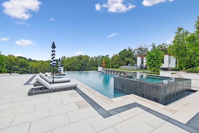6490 Peytonsville Arno Rd, College Grove, TN 37046 - view of swimming pool featuring a patio, an infinity pool, and an in ground hot tub